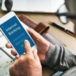 An image representing a laptop and a bank symbol, conveying the ease of online business banking.