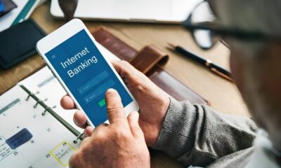 An image representing a laptop and a bank symbol, conveying the ease of online business banking.