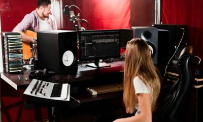 Students collaborating in a music production studio, representing the creative atmosphere of Los Angeles music schools.